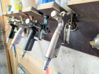 Spray pistoles for varnishing in a painters shop garage are ideal for automobile airbrushing with a compressor to repair cars or craft with a spray gun expert equipment wonderful motives on the hood