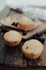 The tasty muffins with chocolate on a wooden desk. Muffins for perfect and beautiful breakfast. 