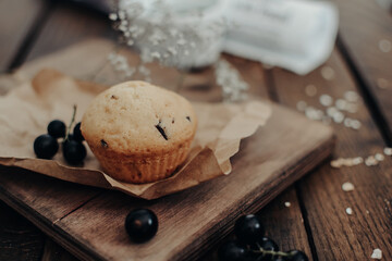 The tasty muffins with chocolate on a wooden desk. Muffins for perfect and beautiful breakfast. 