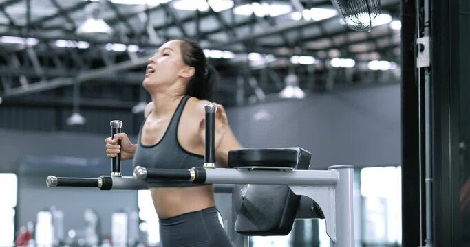 Sporty young asian women doing exercises with bodyweight at fitness gym