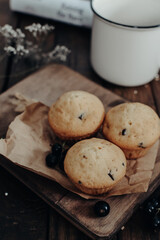 The tasty muffins with chocolate on a wooden desk. Muffins for perfect and beautiful breakfast. 