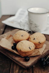 The tasty muffins with chocolate on a wooden desk. Muffins for perfect and beautiful breakfast. 