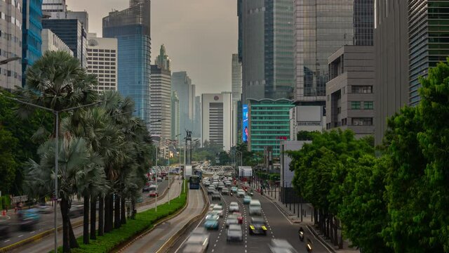 sunny sunset jakarta city downtown traffic street famous fountain square timelapse panorama 4k indonesia