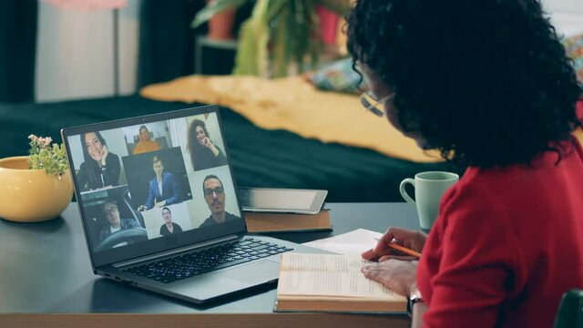 Video lesson is being carried out by an african lady in quarantine. Online learning, distance eductaion, remote studying concept.