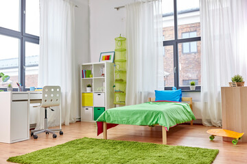interior, home and furnishing concept - kid's room interior with bed, table and bookcase