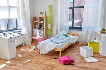 mess, disorder and interior concept - view of messy home kid's room with scattered stuff