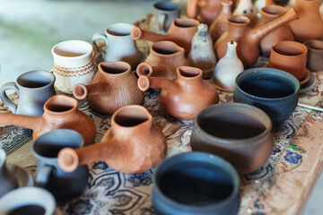 Clay pottery ceramics. Many different pottery standing in a potery workshop.