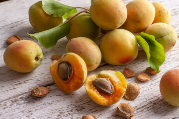 Apricot fruit. Fresh organic apricots on a white wooden background. Vega food.