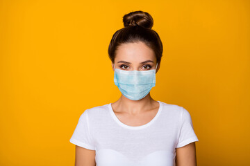 Close-up portrait of her she nice attractive charming pretty girl wearing safety gauze mask stop viral pneumonia syndrome flue contamination prevention isolated vibrant yellow color background