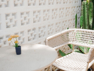 White table and chair placed in backyard.