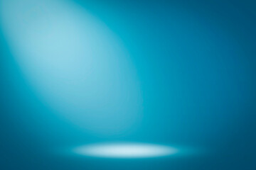 On a blue background, the spotlight shines down. Light source, artificial light.