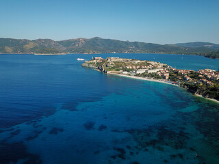 Fototapeta premium Drone view of Elba island northern coastline. Portoferraio and its white cliffs beaches. Capo Bianco. Italy 