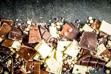 Broken pieces of dark, milk and white chocolate