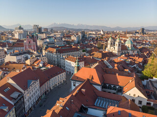 Fototapeta na wymiar Panoramic view of Ljubljana, capital of Slovenia, at sunset. Empty streets of Slovenian capital during corona virus pandemic social distancing measures in 2020.