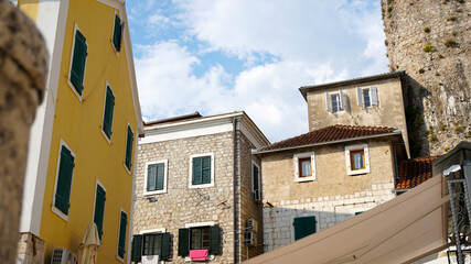 Naklejka premium Old town, street, houses, windows. Beautiful elements of old towns in Montenegro.