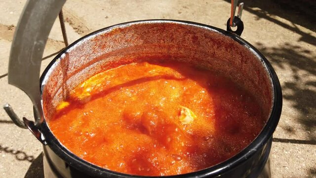 Hungarien fish soup with paprika,onuion and fish.