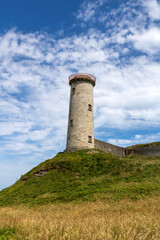 Fototapeta na wymiar old lighthouse on the coast of Ireland. county Wicklow. Ireland.