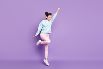 Full length body size view of nice attractive purposeful pretty slim fit serious focused girl jumping striving isolated on violet purple lilac bright vivid shine vibrant color background