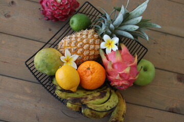 Obraz na płótnie Canvas exotic fruit on a wooden table