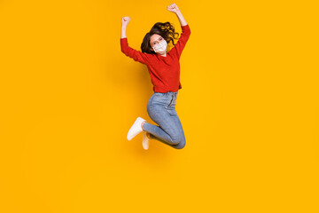 Fototapeta na wymiar Full length body size view of her she nice attractive lovely wavy-haired girl jumping wearing gauze mask rejoicing win winner isolated on bright vivid shine vibrant yellow color background