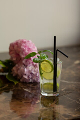 Mojito cocktail served in on marble table