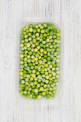 Peas close-up Microgreen. Growing sprouted peas. Sprouting pea seeds at home. Vegan and healthy eating concept. Sprouted pea seeds, micro greens