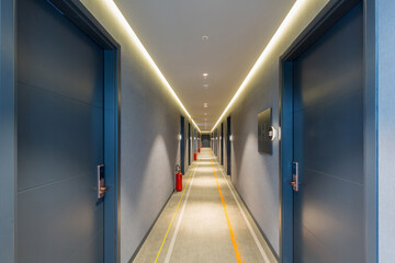 Interior of a long hotel corridor