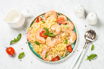 Pasta seafood with shrimp on white table.