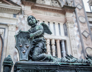 Fototapeta premium Bronze sculpture in the old square in front of the Duomo in Bergamo. Lombardy, Italy