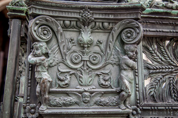 Bronze high reliefs on the fence of the Duomo in the city of Bergamo. Lombardy, Italy