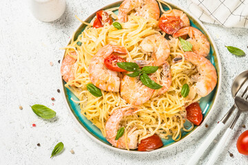 Pasta seafood with shrimp on white table.