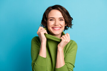 Portrait of nice candid girl touch collar hands enjoy autumn season outfit isolated over blue color background