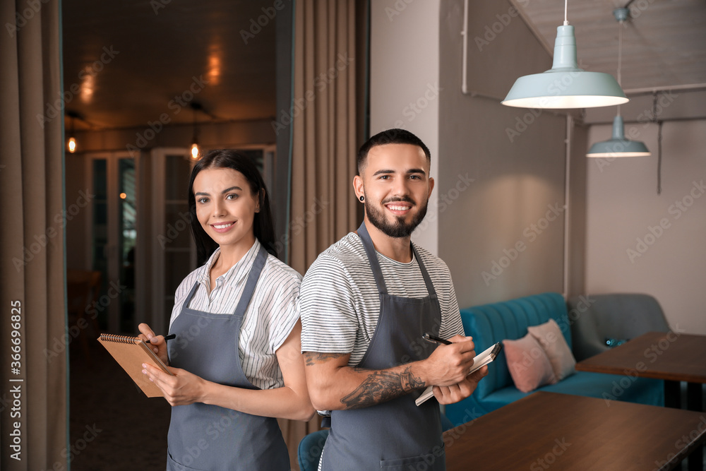 Sticker Portrait of young waiters in restaurant