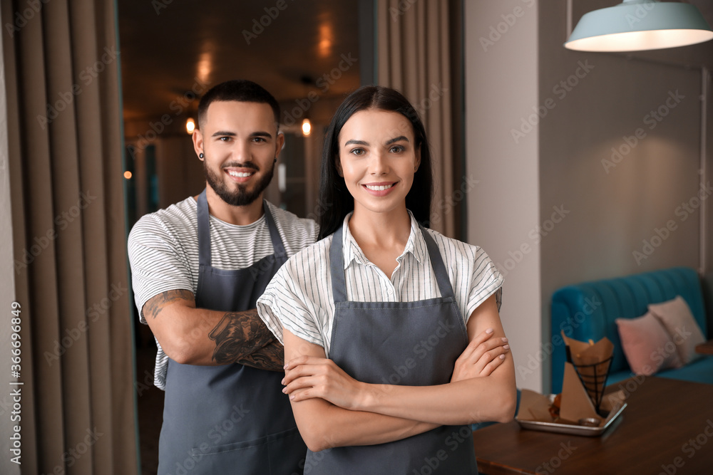 Sticker Portrait of young waiters in restaurant