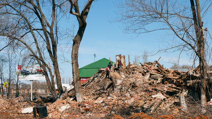 Chapaevsk, Russia-April, 11, 2018: people disassemble the ruins of collapsed houses after the elements, debris analysis