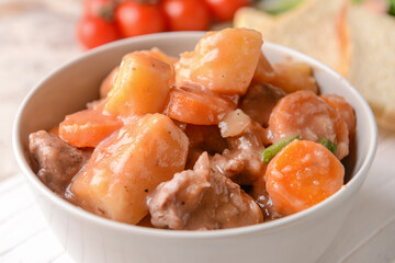 Bowl with tasty beef stew, closeup