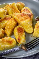 Homemade lazy noodles with cheese, crumbs and melted butter.