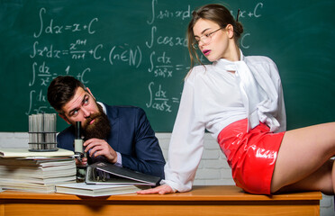 Lustful tutor. Girl sexy buttocks sit table. Everyone dreaming about such teacher. Experimenting...