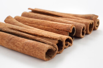 Cinnamon sticks on white background