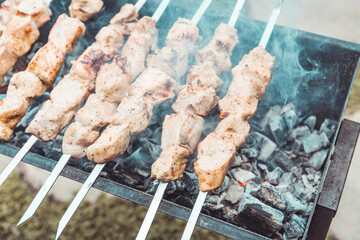Meat grilling on the brazier. Selective focus.