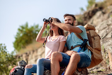 Couple looking through binocular