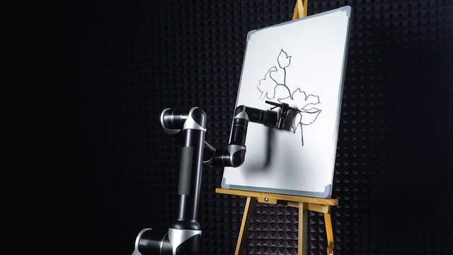 Programmed robot draws a flowers, a futuristic robot hand draws a marker on a blackboard, robot learns to draw, modern technology, timelapse.