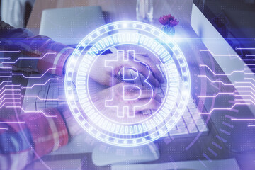 Blockchain theme hud with man working on computer on background. Concept of crypto chain. Double exposure.