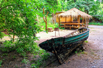 Boat and wooden house in African Aboriginal Village