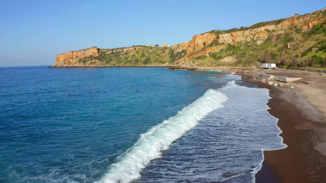 Spring view of Torre Conca beach. Marvelous morning seascape of Mediterranean sea. Outdoor scene of Sicily, Italy, Europe. 4k drone flight moving to the side footage (Ultra High Definition).