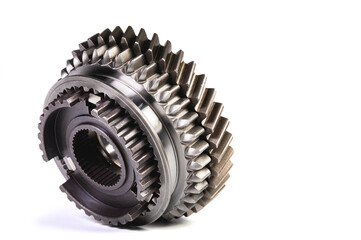 The two new shiny metal gear of the switch box is fronted by a isolated on white background. The concept of new spare parts for car maintenance and repair