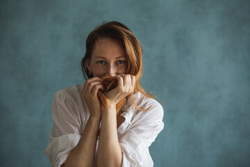 a girl, a woman covers her face with her hands