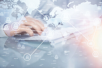 Social network theme hologram with businessman working on computer on background. Multi exposure.