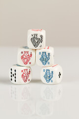 Kings, Queens and Jacks Playing Casino poker dice closeup Isolated on white background with reflection. Abstract Pattern
