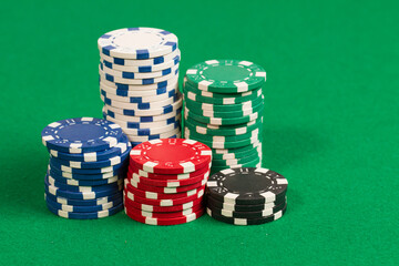 Various colors Casino Playing Poker Chips. Abstract Pattern Background. Isolated on green background table